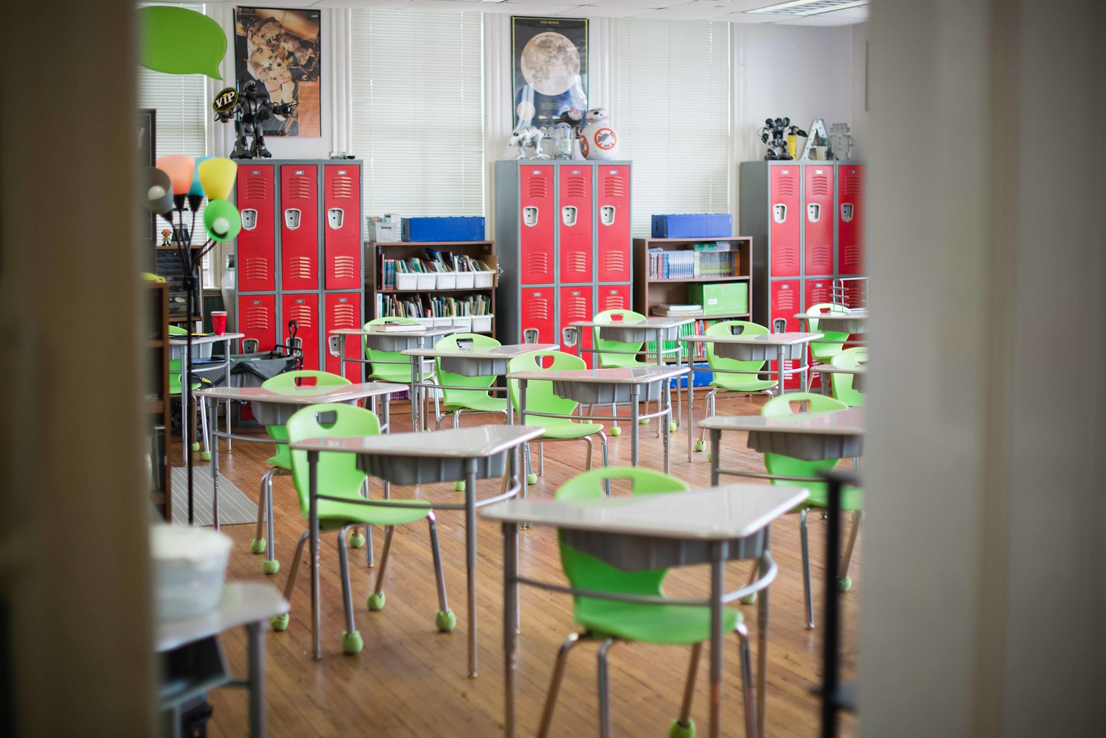 Elementary school classroom with desks, lockers, science equipment